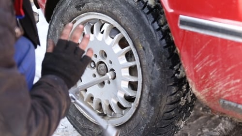 Worker Untwists Wheel