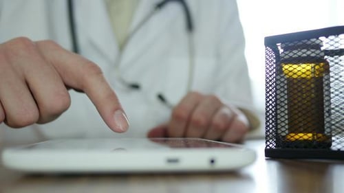 Doctor Using Tablet for Medical Information