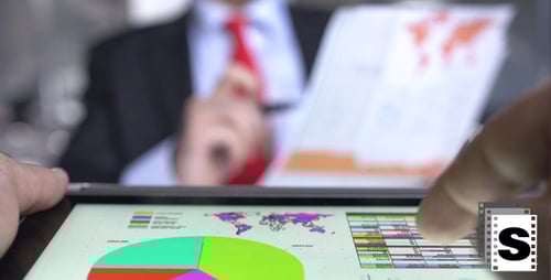 Business Data on Tablet with Graphs and Charts
