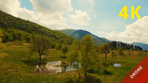 Aerial View of a Beautiful Valley and Mountains in a Sunny Day