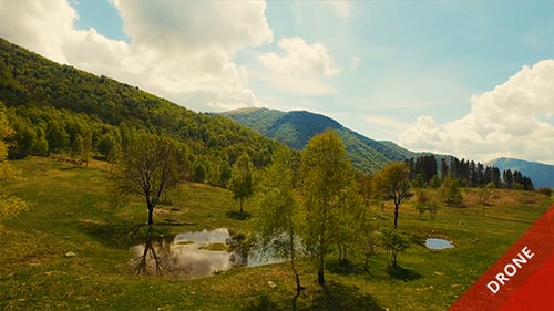 Aerial View of a Beautiful Valley and Mountains in a Sunny Day