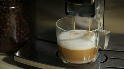 Espresso Machine Dispenses Cappuccino in Glass Mug