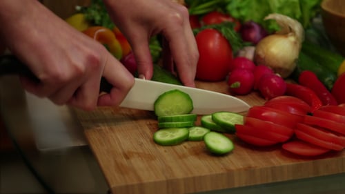 Cucumber Slices Being Prepared for Cooking