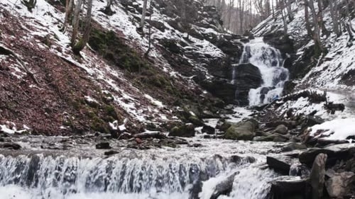 Fast Flowing Water in a Waterfall During Winter
