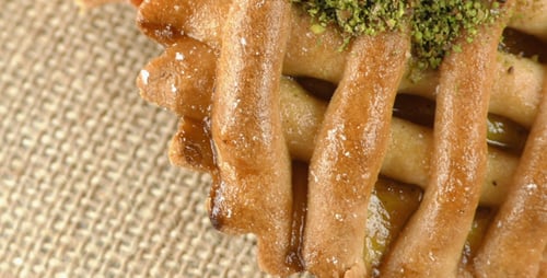 Close-up of Delicate Golden Brown Tarts with Syrup