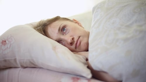 Woman Resting in Bed, Indoor Close-Up