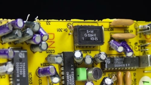 Detailed Close-Up of a Yellow Circuit Board