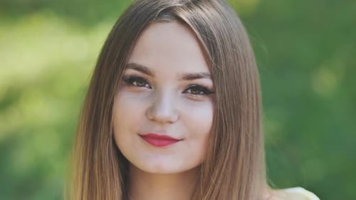 Portrait of a Young Girl in a Park