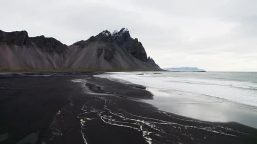 Drone Over Black Sand Beach Towards Sea And Vestrahorn Mountain