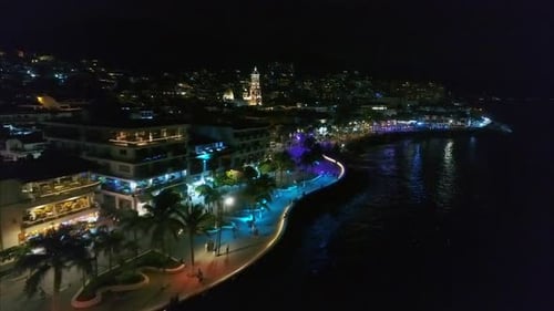 Vibrant City Coastline at Night from Above