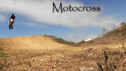 Motocross Rider Jumps on a Dirt Track