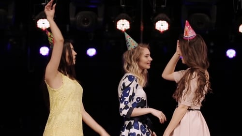 Happy Friends Celebrating a Birthday with Champagne