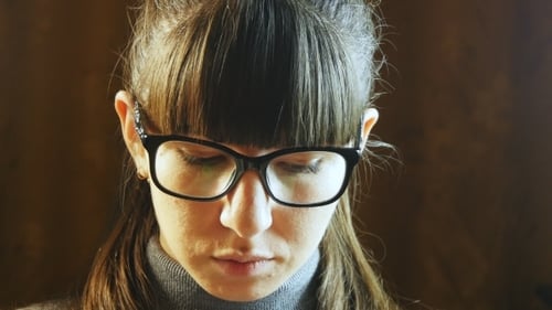 Beautiful Woman In Big Black Glasses Reading