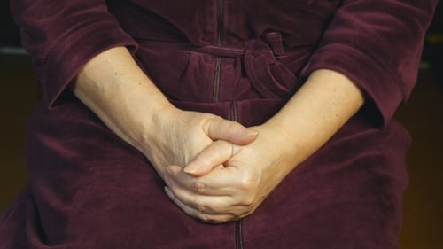 Hands Giving Pink Teddy Bear Wrapped Present