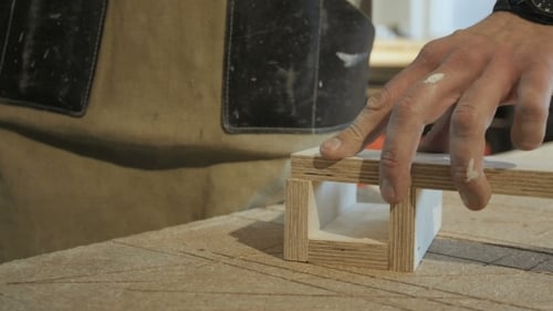 Adult Attaching Wood to Box with Nail Gun