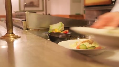 Salads Being Prepared in Restaurant Kitchen