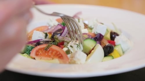 Close Up of Fresh Greek Salad Being Prepared