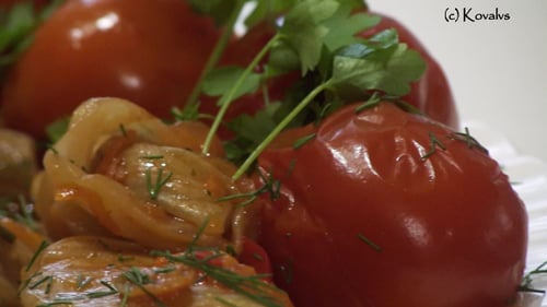 Plate of seasoned cooked vegetables with tomatoes