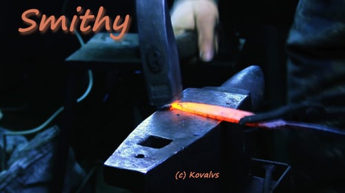 Blacksmith Forging Red Hot Metal on Anvil
