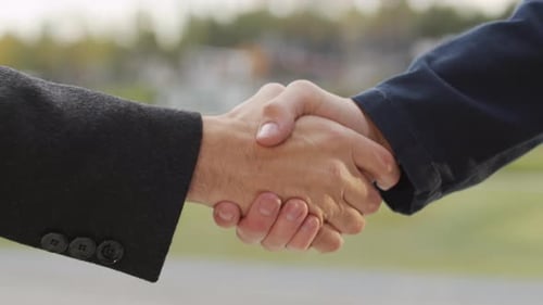 Close Up Of Unrecognizable Men Shaking Hands