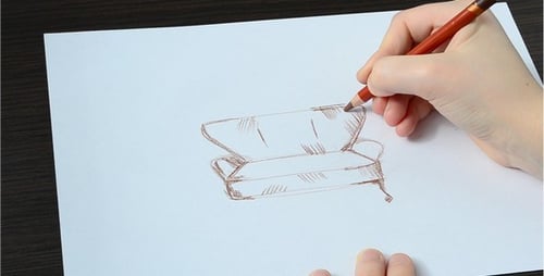 Hand Drawing a Couch on Paper with Pencil