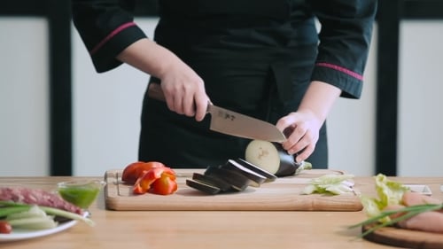 Professional Chef Cutting Eggplant
