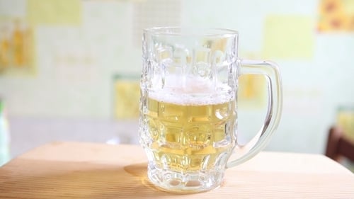 Light Beer being Poured into Glass Tankard