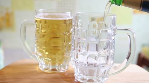 Pouring Beer Into Glass Mug, Close Up Shot