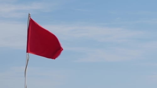 Red Flag Waving Dangerously in the Wind