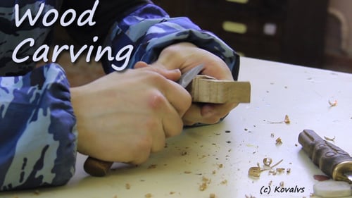 Wood Carving at a Table with a Knife