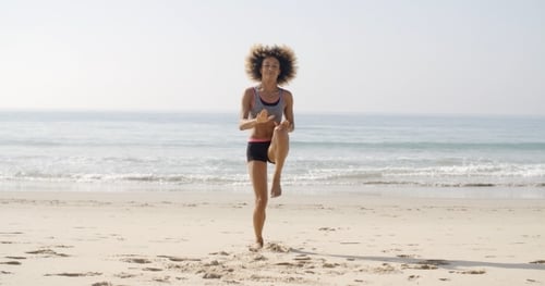 Young Sport Woman On The Beach