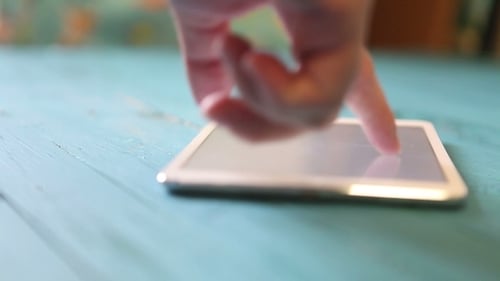 Man Uses Tablet