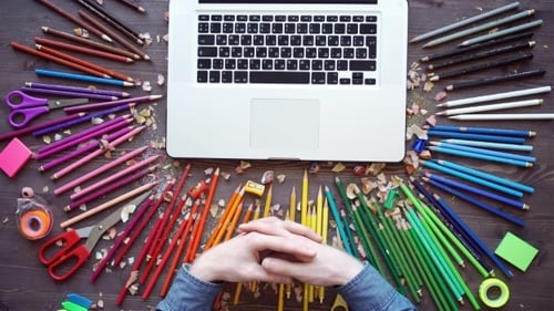 Workplace With Colored Pencils, Laptop, Palette On Wooden Table