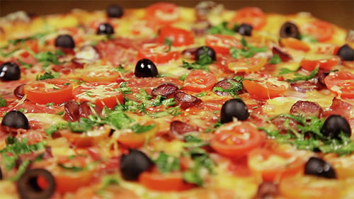 Close Up of Appetizing Pizza with Tomatoes and Olives