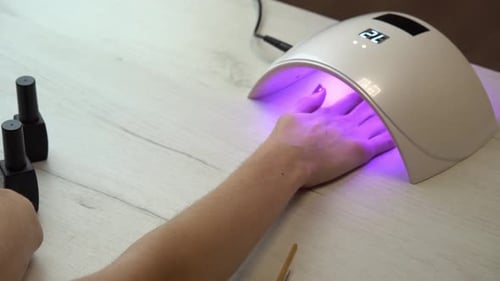 Gel Manicure Under Ultraviolet Light at Home