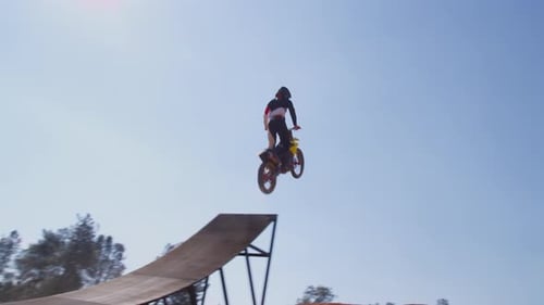 Motorcyclist Performs Backflip Stunt at Dirt Park
