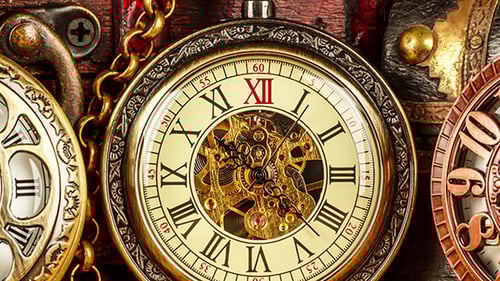 Antique Pocket Watches and Timepieces on an Old Map