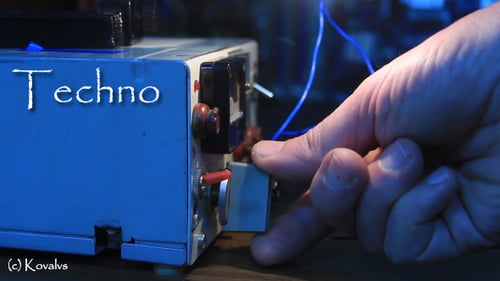 Hand Adjusting Electronic Device in Close Up