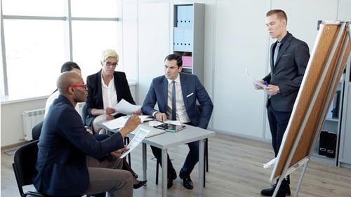 Business Meeting in Modern Office with Presentation