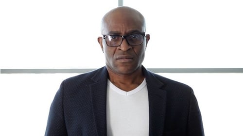 Adult Man With Glasses Standing Indoors