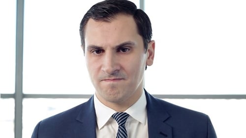 Man in Suit Looking Down and Up