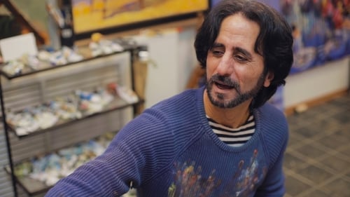 Artist Talking in His Art Studio