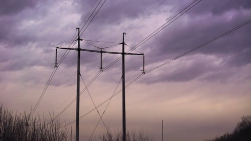 Communications Tower under Overcast Sky during Sunset