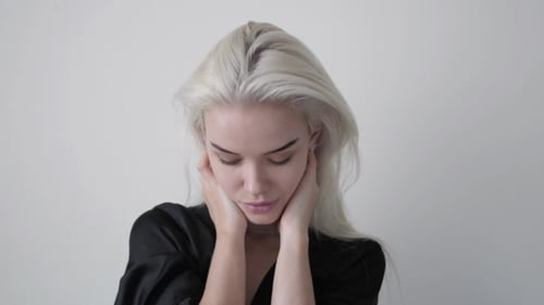 Attractive Woman with Blonde Hair Posing Indoors