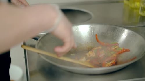 Chef Cooks Shrimp and Vegetables in Wok