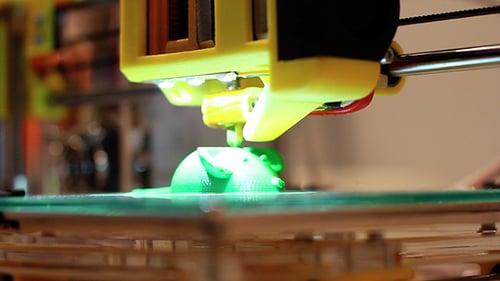 3D Printer Fabricating a Three Dimensional Green Mouse