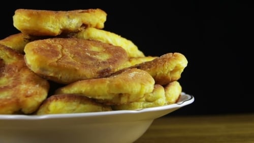 Pile of Fried Pastries on Plate, Close Up