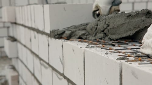 Applying Mortar to Brick Wall Close Up