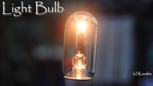 Close Up of a Clear Lightbulb Turning On