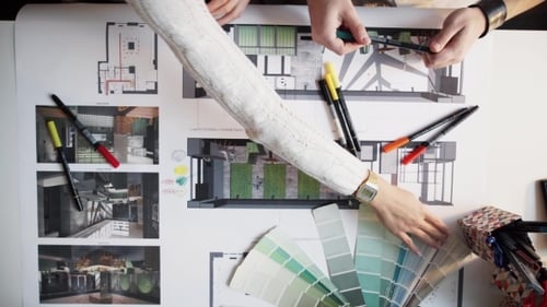 Architects Collaborate on Interior Design Blueprint Plans